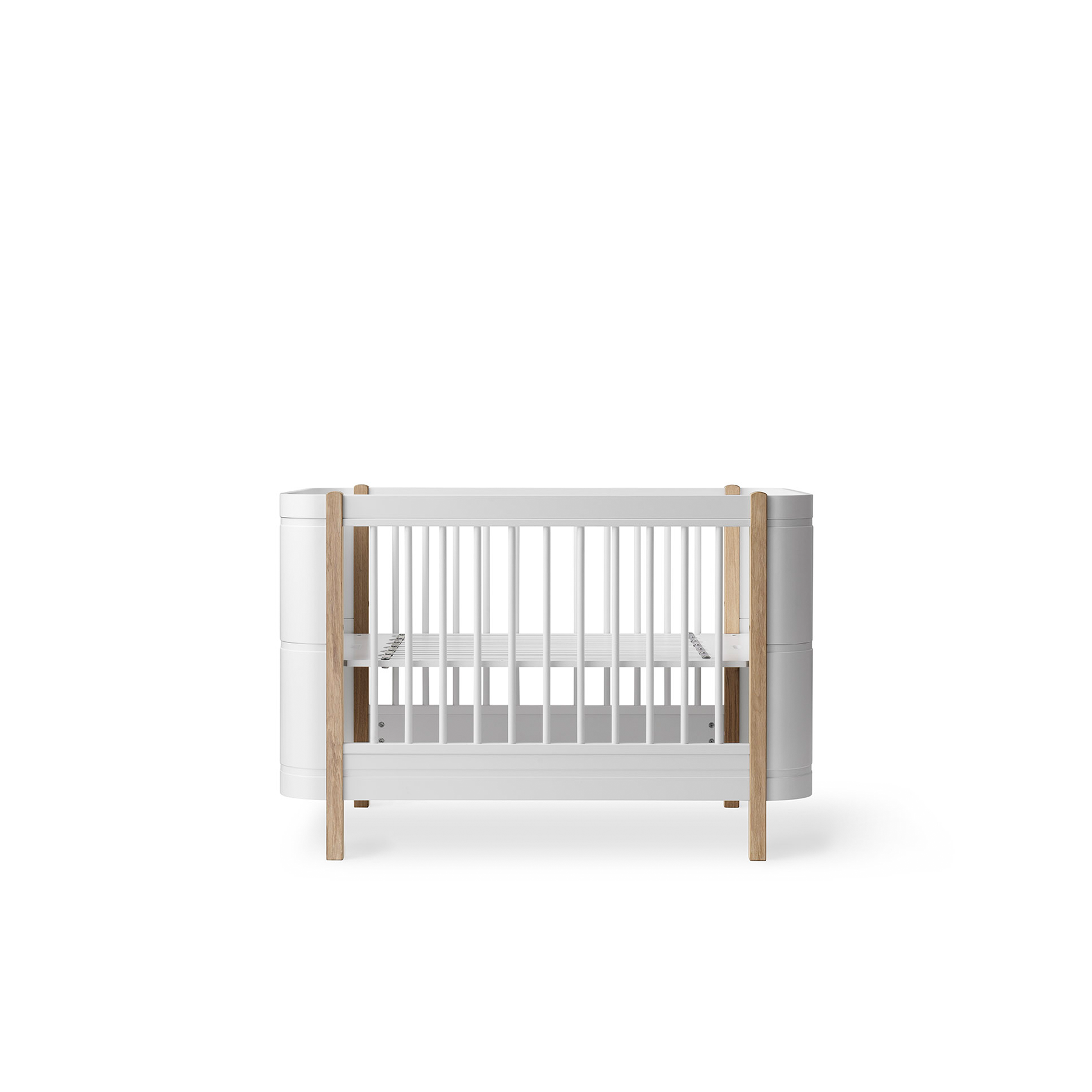 White crib with wooden accents on a white background